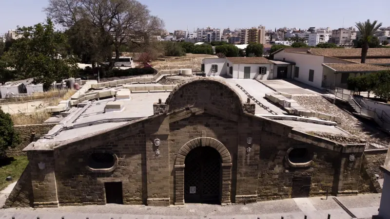 The Famagusta Gate in the Venetian walls of Nicosia, Cyprus, a stone arched gateway under a clear sky with the modern city behind.